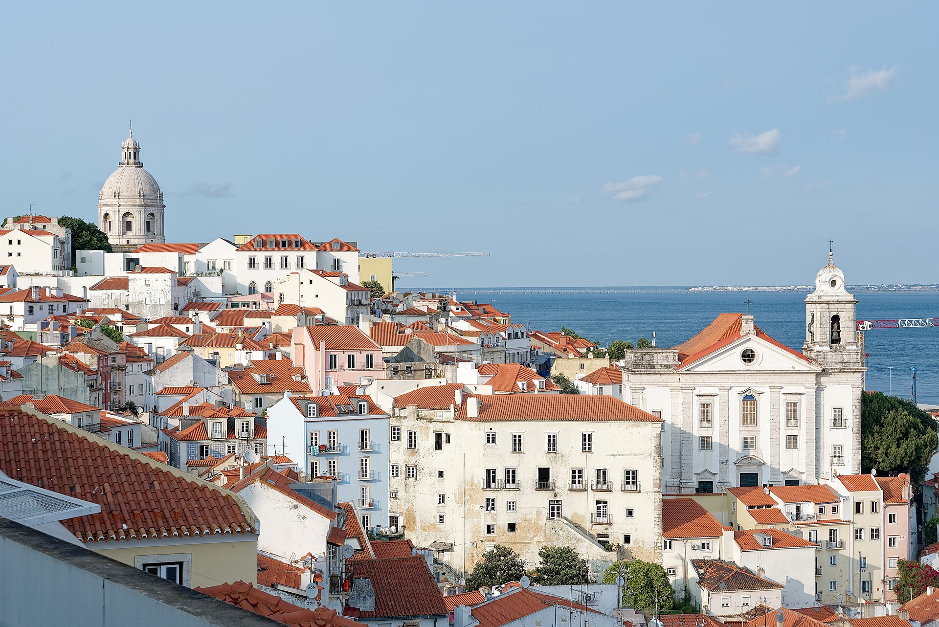 Lisbon’s white buildings and red roofs overlooking the Tagus from Santa Luzia