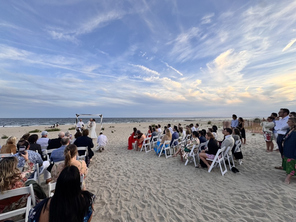 Guests gathered on the beach for the Rockaway wedding ceremony
